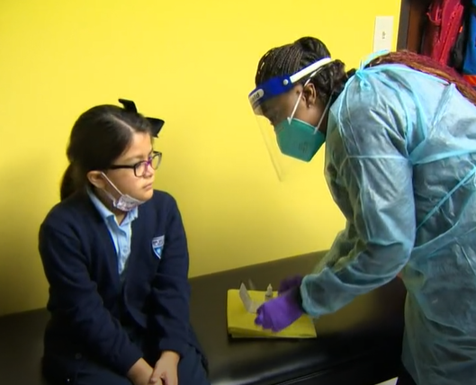 Child receiving Covid test